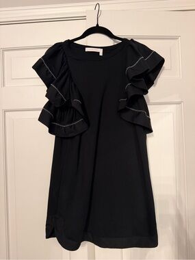 See By Chloé 100% Cotton black dress with oversized ruffle sleeve.